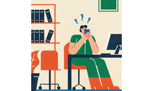 worker in the office while on their phone