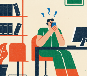 worker in the office while on their phone